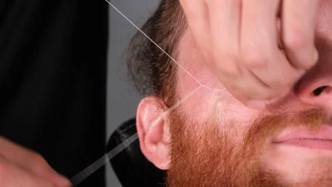 Barber does the hairstyle Stock-Footage 240133744