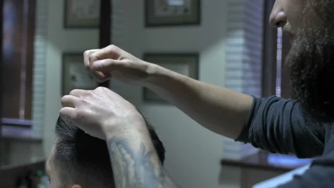 Barber does the styling to a man5 Stock Footage 88224070