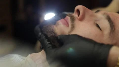 Barber Doing Face Massage To Bearded Man In Barbershop. Close Up Face Washing Stock Footage 139765209