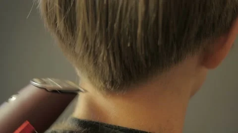 Barber doing a haircut with clipper Stock Footage 61101101