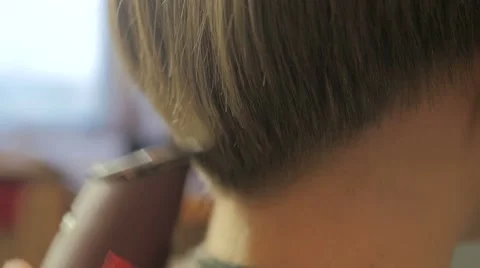 Barber doing a haircut with clipper Stock Footage 61101385