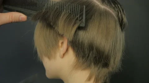 Barber doing a haircut with scissors Stock Footage 61101409