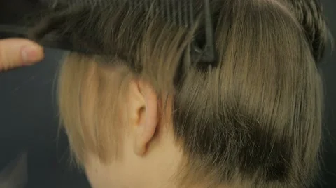 Barber doing a haircut with scissors Stock Footage 61101606