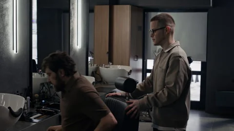 Barber Greeting Client and Starting Communicating Stock Footage 330408749