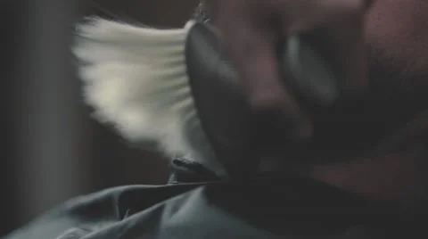 Barber hand brush clean man neck after beard cutting HD slow close-up video Stock Footage 68378103