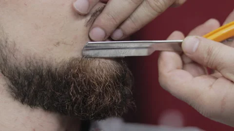 Barber lines beard with a razor Video stock 147459375