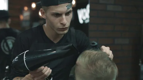 Barber makes the blow-dry. Stock Footage 80026365