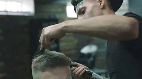 Barber makes the blow-dry. Video stock 80027373