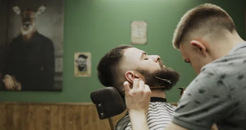 Barber makes hair styling Stock Footage 133186402