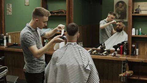 Barber makes hair styling Stock Footage 133187763