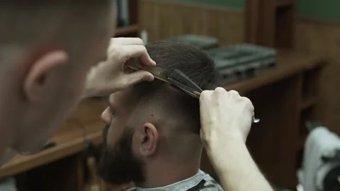 Barber makes hair styling Stock Footage 133187846
