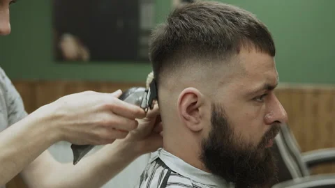 Barber makes hair styling Stock Footage 133188029