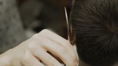 Barber makes hair styling Stock Footage 133188153