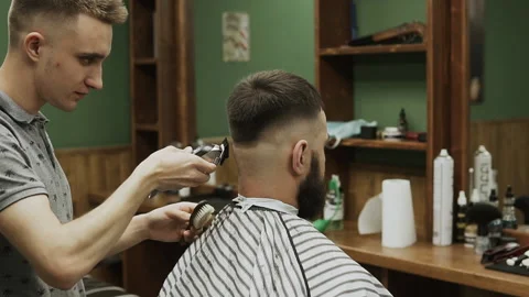 Barber makes hair styling Stock Footage 133188307