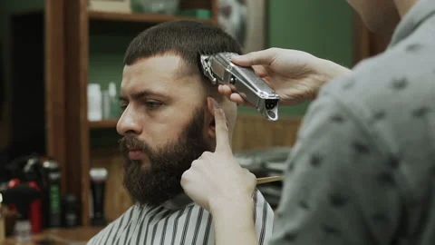 Barber makes hair styling Stock Footage 133188415