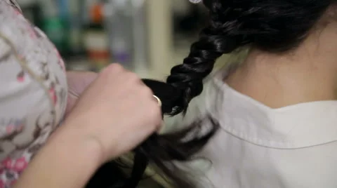 Barber making beautiful hairdo with braid Stock Footage 63317014