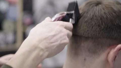 Barber making haircut using machine Stock Footage 88443254