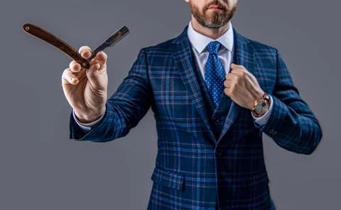 Barber man with razor blade, selective focus. man with blade in barber studio. Stock Photos