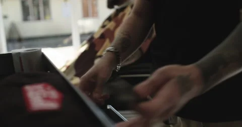 Barber picks out scissors from his tool cabinet Stock Footage 141968798