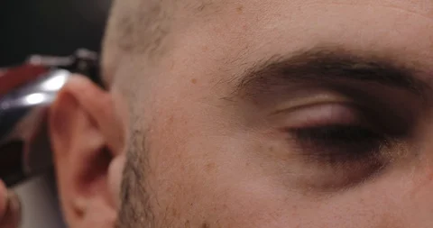 Barber prepares the client for shaving, bald haircutting Stock Footage 91385990
