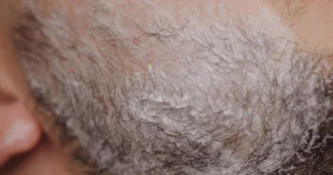 Barber prepares the client for shaving Stock Footage 91386472