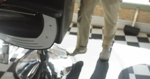 Barber pumps up chair Stock Footage 141944937