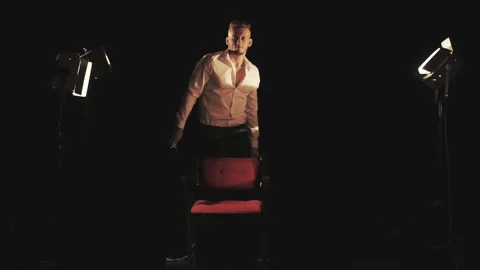 Barber with scissors and comb in the rays of light Stock Footage 134349672