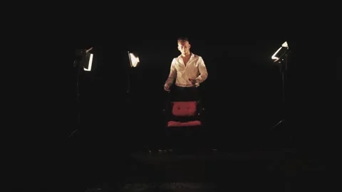 Barber with scissors and comb in the rays of light Stock Footage 134350055