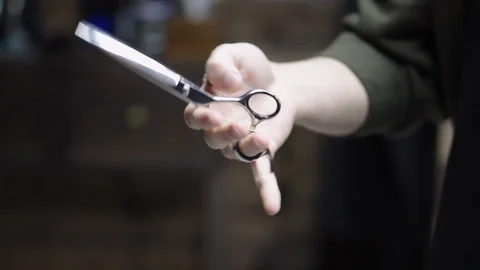 Barber scissors picks up Stock Footage 88158773