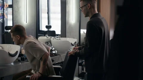 Barber Shaking Hands with Client in Salon Stock Footage 330420558