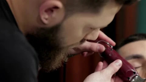 Barber shave and modeling beard at the hair salo Stock Footage 252660426