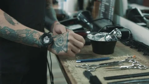 Barber shaves the beard of the client. Stock Footage 80028537