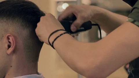 A barber shaving man's nape Stock Footage 76110536