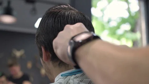 Barber shears the client's hair. Stock Footage