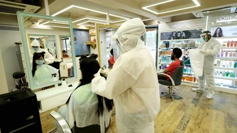 Barber shops and salons reopen with restrictions Vídeos de archivo 133748795