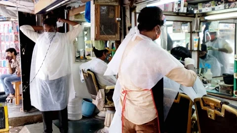 Barber shops and salons reopen with restrictions Video stock 133749536