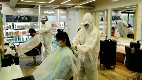 Barber shops and salons reopen with restrictions Vídeos de archivo 133749705