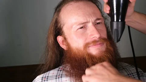 Barber straightens beard Stock Footage 238014673