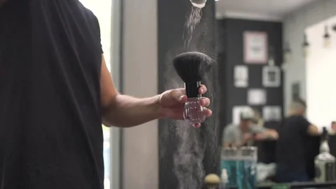 Barber sulpate talc on the brush, before applying to the skin. Stock Footage