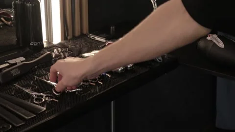 Barber takes scissors from the table 库存影片 200204047