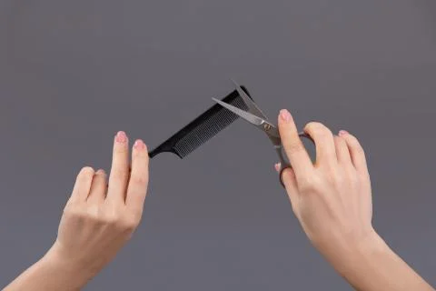 Barber tools: scissors,comb, paint brush in the hands of the master Stock Photos