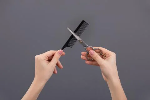Barber tools: scissors,comb, paint brush in the hands of the master Stock Photos