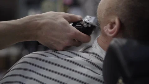 Barber trimming beard to his client Stock Footage 88158822