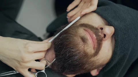 Barber Trimming Client Beard With Scissors 動画素材 342519474