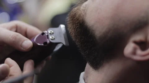 Barber trims beard with clippers Video stock 147452115