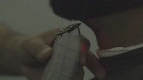 Barber using clippers to edge up a beard s-log prores 422 Stock Footage 236415840