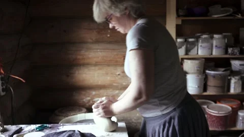 Barber using a comb while providing a haircut for man with long hair Stock Footage 132055242