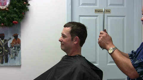 Barber Using Mirror To Show Client His Hair Cut. Stock Footage 33495271