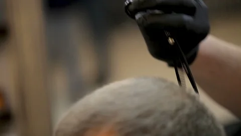 Barber using scissors and comb Stock Footage 125270706