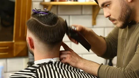 Barber using trimming machine Stock Footage 91214700